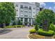 Modern condo building featuring manicured landscaping and tree lined streets at 747 Ralph Mcgill Ne Blvd # 337, Atlanta, GA 30312