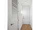 Clean hallway featuring hardwood floors, white doors, and neutral paint at 747 Ralph Mcgill Ne Blvd # 337, Atlanta, GA 30312