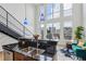 Kitchen and living area with bar top and stainless steel appliances, with staircase leading to upper level at 747 Ralph Mcgill Ne Blvd # 337, Atlanta, GA 30312