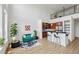 Open-concept living area with adjacent kitchen, featuring stylish furnishings and modern appliances, with a staircase to a lofted area at 747 Ralph Mcgill Ne Blvd # 337, Atlanta, GA 30312
