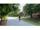 Scenic paved path surrounded by lush greenery and mature trees, perfect for biking or walking at 747 Ralph Mcgill Ne Blvd # 337, Atlanta, GA 30312