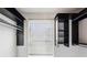 A large walk-in closet featuring modern black organizers and a window for natural light at 747 Ralph Mcgill Ne Blvd # 337, Atlanta, GA 30312