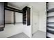 A spacious walk-in closet featuring dark shelving and hanging space, with a doorway visible in the background at 747 Ralph Mcgill Ne Blvd # 337, Atlanta, GA 30312
