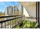 Charming balcony with skyline view, lush greenery, and comfortable seating at 1130 Piedmont Ne Ave # 907, Atlanta, GA 30309