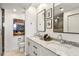 This bathroom offers a double sink vanity, ample counter space, and a glass shower enclosure at 1130 Piedmont Ne Ave # 907, Atlanta, GA 30309