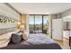Spacious bedroom with balcony access that overlooks the city skyline at 1130 Piedmont Ne Ave # 907, Atlanta, GA 30309
