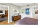 This bedroom provides lots of space, posters hanging on the wall, and an adjacent bathroom at 1130 Piedmont Ne Ave # 907, Atlanta, GA 30309