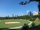 Scenic city park with walking path, volleyball net, and city skyline at 1130 Piedmont Ne Ave # 907, Atlanta, GA 30309