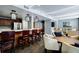 Open-concept community kitchen with bar seating, modern appliances, and a cozy lounge area at 1130 Piedmont Ne Ave # 907, Atlanta, GA 30309