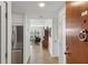 Inviting condo hallway showcasing hardwood floors and a glimpse of the living area beyond at 1130 Piedmont Ne Ave # 907, Atlanta, GA 30309