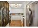 Modern galley kitchen with stainless appliances, skylight, and white cabinetry at 1130 Piedmont Ne Ave # 907, Atlanta, GA 30309