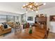 Open-concept living and dining room with cityscape views and modern lighting at 1130 Piedmont Ne Ave # 907, Atlanta, GA 30309