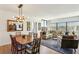 Open-concept living area with dining table, modern lighting, and large windows for natural light at 1130 Piedmont Ne Ave # 907, Atlanta, GA 30309