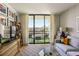 This living room features a great view, light hardwood floors, and plenty of seating options at 1130 Piedmont Ne Ave # 907, Atlanta, GA 30309