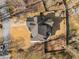 Aerial view of the property showcasing the house, driveway, backyard, and surrounding landscape at 1354 Larson Sw Ct, Marietta, GA 30064
