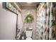 Well decorated bathroom with decorative wall hangings and colorful shower curtain at 1354 Larson Sw Ct, Marietta, GA 30064