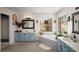 Bright bathroom features double sinks, a soaking tub under a window, and a separate shower at 1354 Larson Sw Ct, Marietta, GA 30064