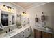 Bathroom featuring a double vanity and decorative accents at 1354 Larson Sw Ct, Marietta, GA 30064