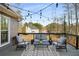 Relaxing outdoor deck with string lights, comfortable seating, and peaceful wooded view at 1354 Larson Sw Ct, Marietta, GA 30064