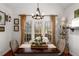 Bright dining area with natural light showcases rustic chandelier and shiplap accent wall at 1354 Larson Sw Ct, Marietta, GA 30064