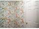 Hallway featuring colorful floral wallpaper and a white door at 1354 Larson Sw Ct, Marietta, GA 30064