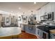 Charming kitchen with stainless steel appliances, tile backsplash, and an island, offering ample counter space at 1354 Larson Sw Ct, Marietta, GA 30064