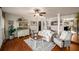 Bright living room featuring hardwood floors, white walls, and comfortable seating arrangements at 1354 Larson Sw Ct, Marietta, GA 30064