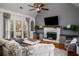 Inviting living room with fireplace, large windows, and comfortable seating arrangement at 1354 Larson Sw Ct, Marietta, GA 30064