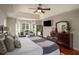 Serene main bedroom featuring plush bedding, natural light, and a spacious layout for relaxation and comfort at 1354 Larson Sw Ct, Marietta, GA 30064