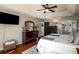 Comfortable main bedroom offering hardwood floors, an ensuite bathroom, and plenty of room for relaxation at 1354 Larson Sw Ct, Marietta, GA 30064