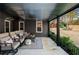 Covered patio with outdoor furniture overlooking a spacious backyard with a playset at 1354 Larson Sw Ct, Marietta, GA 30064