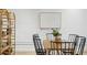 Bright dining area with light walls, modern art, and room for shelves at 1661 La France Ne St # 102, Atlanta, GA 30307
