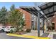 Brick building with modern architectural details, covered parking, and landscaped grounds at 1661 La France Ne St # 102, Atlanta, GA 30307