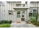 Charming front entrance with a 'Welcome Home' doormat and well-maintained landscaping at 1661 La France Ne St # 102, Atlanta, GA 30307