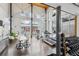 Well-lit gym featuring exercise equipment and free weights for residents' fitness needs at 1661 La France Ne St # 102, Atlanta, GA 30307
