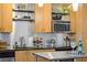 Close up of a modern kitchen with stainless steel appliances and bar seating at 1661 La France Ne St # 102, Atlanta, GA 30307