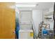 Laundry room with stacked washer and dryer and water heater at 1661 La France Ne St # 102, Atlanta, GA 30307
