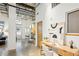 Bright open-concept living space with modern decor, high ceilings, and polished concrete floors for an industrial-chic aesthetic at 1661 La France Ne St # 102, Atlanta, GA 30307