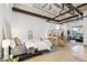 Spacious main bedroom with exposed duct work, polished concrete floors, and an open-concept living space at 1661 La France Ne St # 102, Atlanta, GA 30307