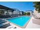 Sparkling community pool surrounded by lounge chairs and well-maintained landscaping at 1661 La France Ne St # 102, Atlanta, GA 30307
