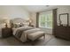 Comfortable bedroom with a neutral color palette, soft textures, and ample natural light at 2687 Ashford Ne Rd, Brookhaven, GA 30319