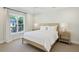 Bright bedroom with a large window, neutral decor, and minimalist furnishings at 2687 Ashford Ne Rd, Brookhaven, GA 30319