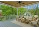Relaxing screened porch with comfortable seating and a view of the surrounding trees at 2687 Ashford Ne Rd, Brookhaven, GA 30319