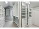 Spacious walk-in closet with custom shelving, mirrored doors, and plenty of room for storage at 2687 Ashford Ne Rd, Brookhaven, GA 30319
