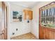 Laundry room with window, laundry hookups, and outdoor access at 5836 Trailwoods Ct, Stone Mountain, GA 30087