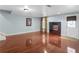 Finished basement featuring beautiful hardwood floors and a built-in entertainment center at 612 Kristen Ct, Mcdonough, GA 30252