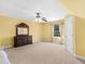 Generous-sized bedroom features a ceiling fan, natural lighting, and neutral walls for personalization at 612 Kristen Ct, Mcdonough, GA 30252