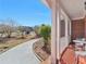 Inviting front porch with white columns and a view of the landscaped front yard at 612 Kristen Ct, Mcdonough, GA 30252