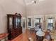 Elegant living room features hardwood floors, high ceilings, and natural light from large windows at 612 Kristen Ct, Mcdonough, GA 30252