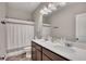 Bathroom features double sink vanity, modern fixtures, and tiled shower with a curtain at 133 Prominence Ct, Canton, GA 30114